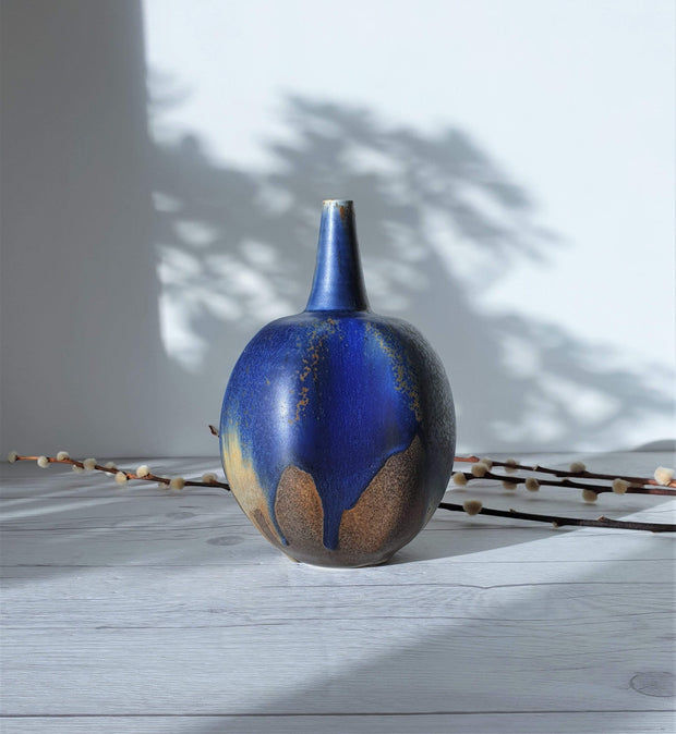 AnyesAttic Porcelain Reiner Gehrig, Grünstadt Studio, Matte Cedar, Sand and Blue Running Glaze Bottle Vase | 1970s