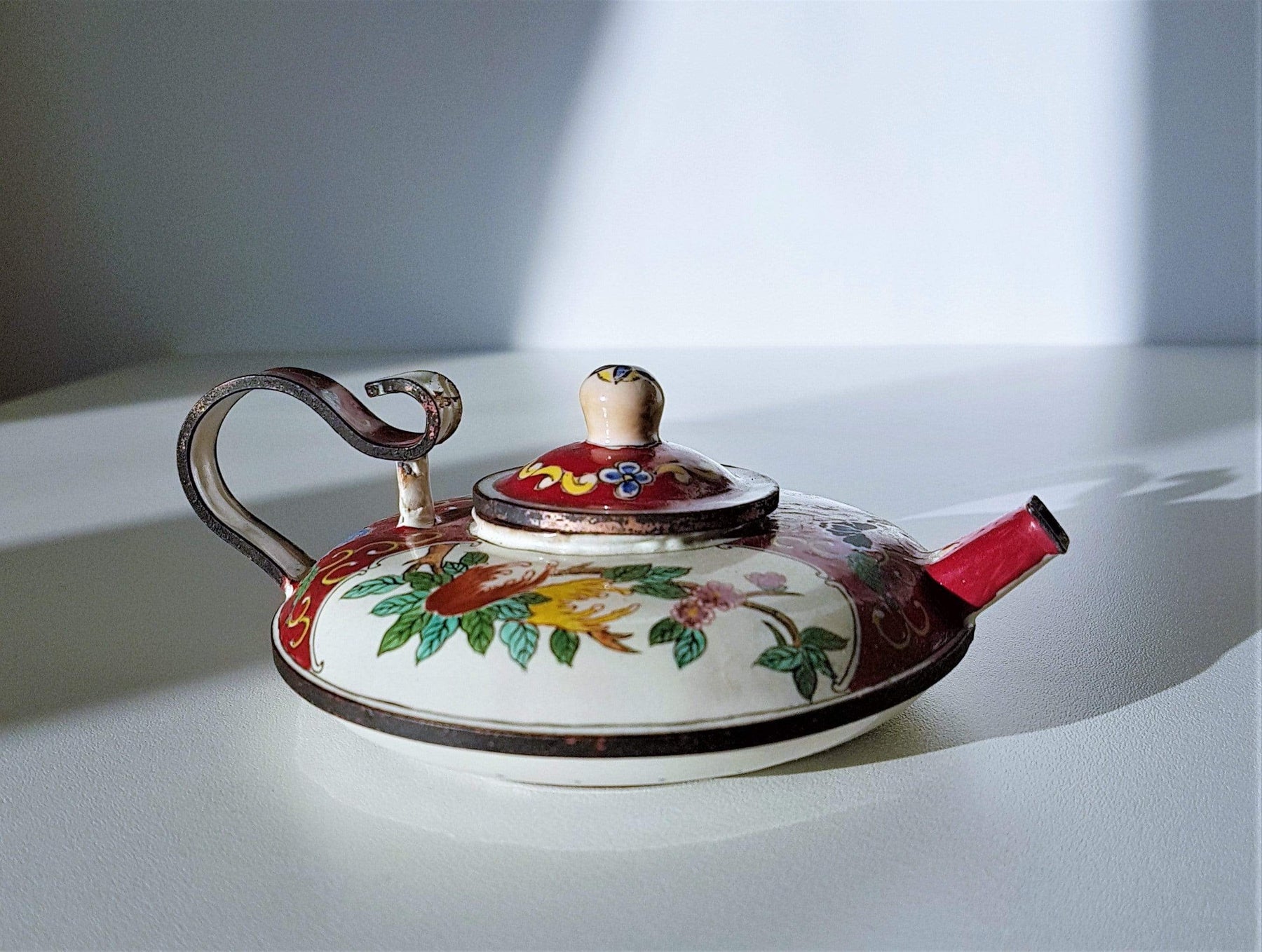 https://hautecurature.com/cdn/shop/products/anyesattic-metals-antique-c-1910s-chinese-falang-painted-enamelwork-canton-enamel-mini-copper-teapot-15475621658693_1800x1800.jpg?v=1613846159